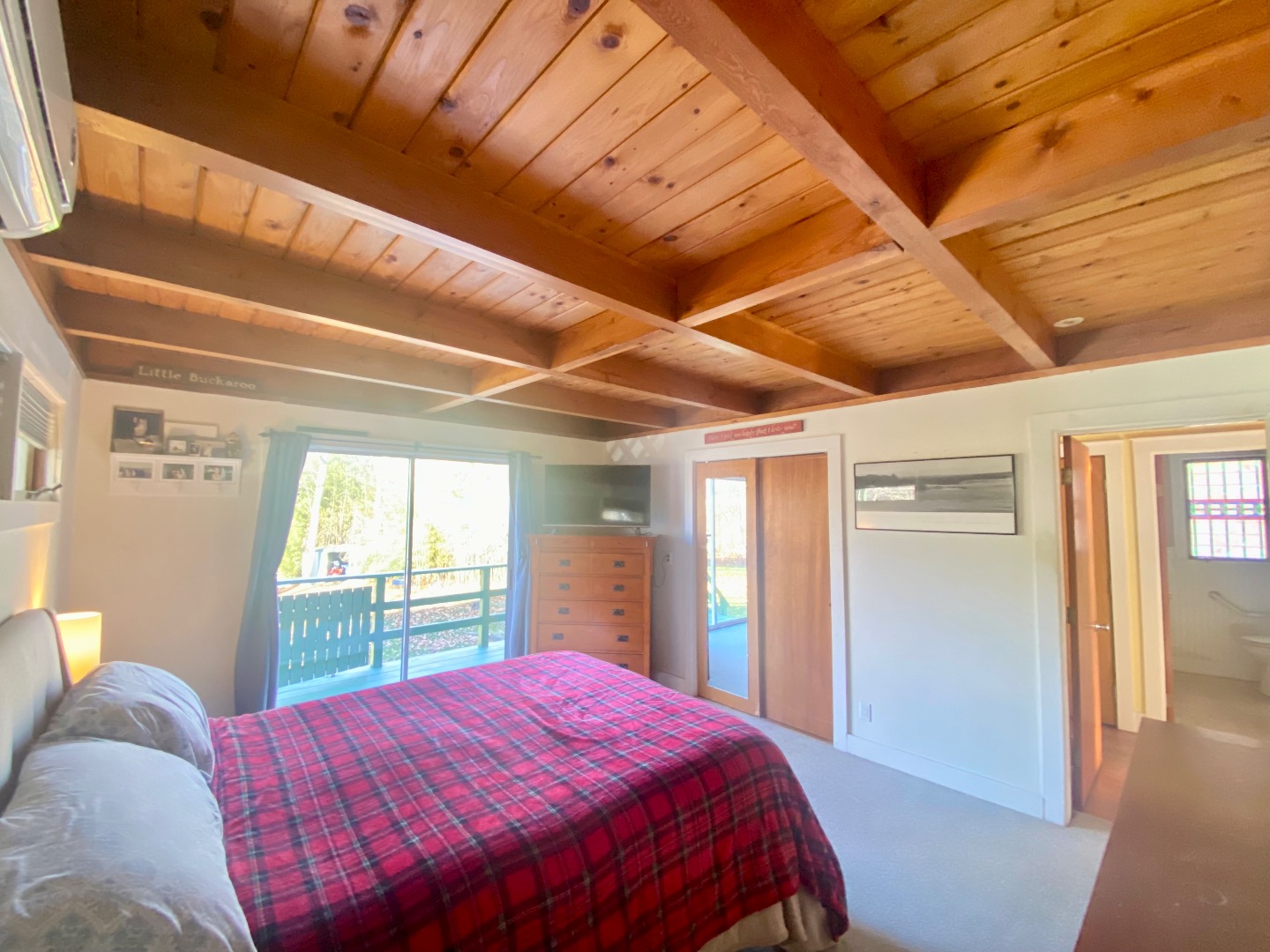 101 Tradewinds Road Oak Bluffs, MA 02557 - Photo 21 of 59 a bedroom with a bed and a large window