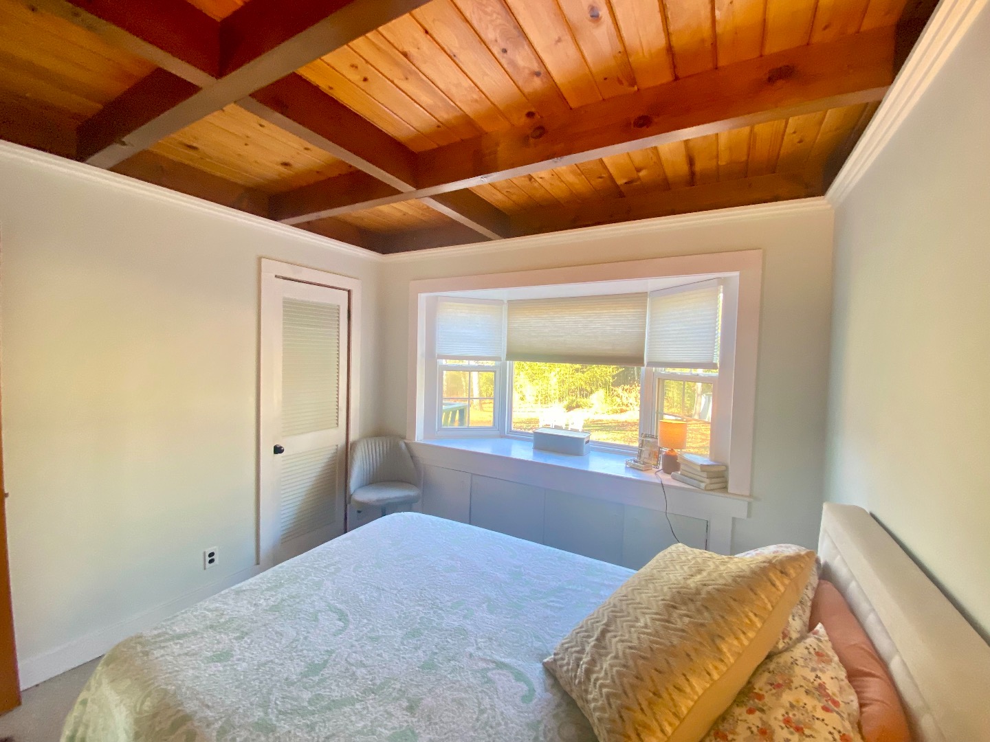 101 Tradewinds Road Oak Bluffs, MA 02557 - Photo 27 of 59 a bedroom with a bed and a window
