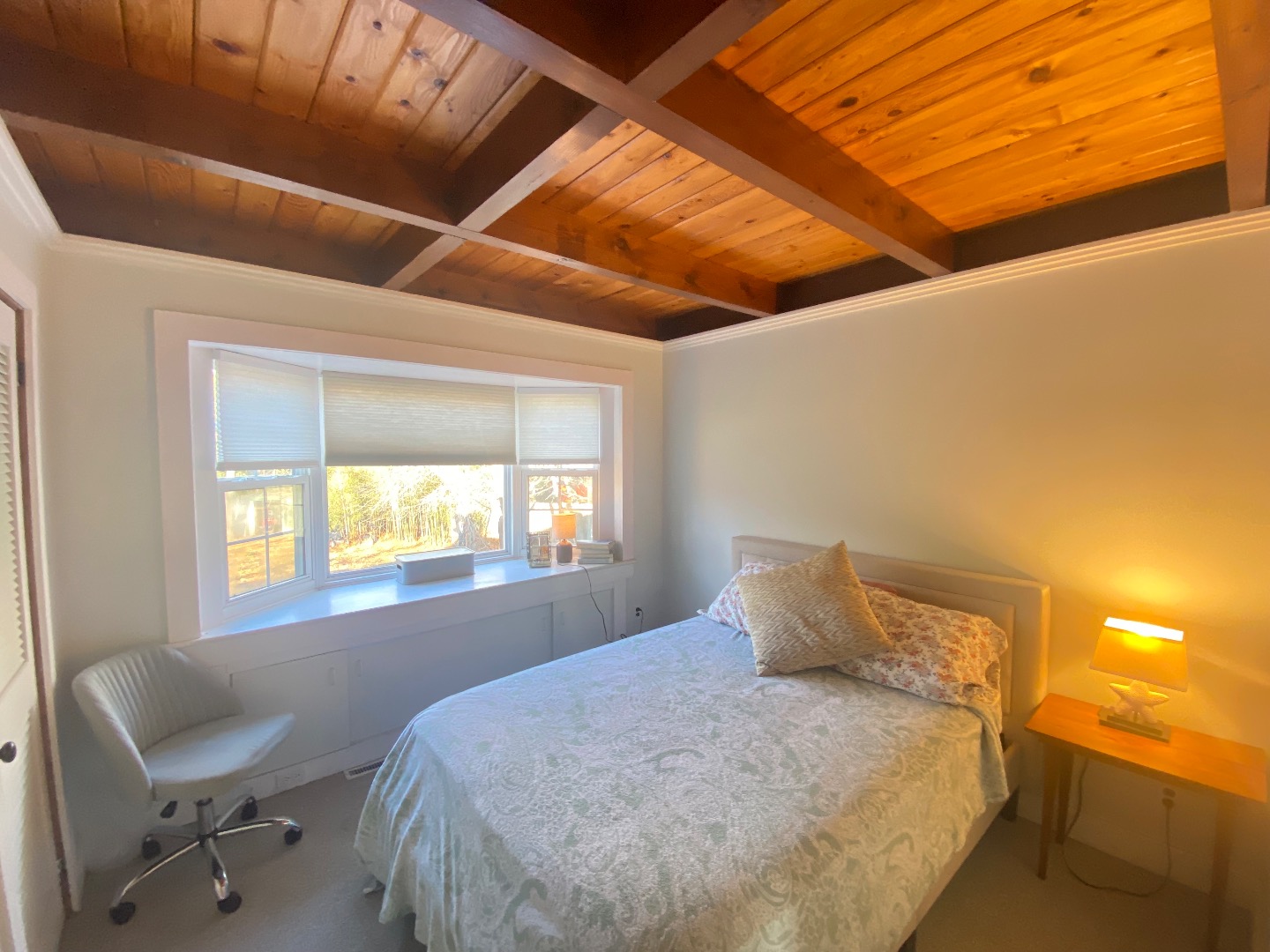 101 Tradewinds Road Oak Bluffs, MA 02557 - Photo 28 of 59 a bed sitting in a bedroom next to a window