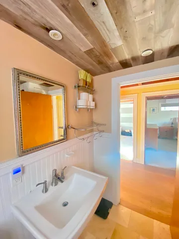 a vase of flowers sitting on a floor