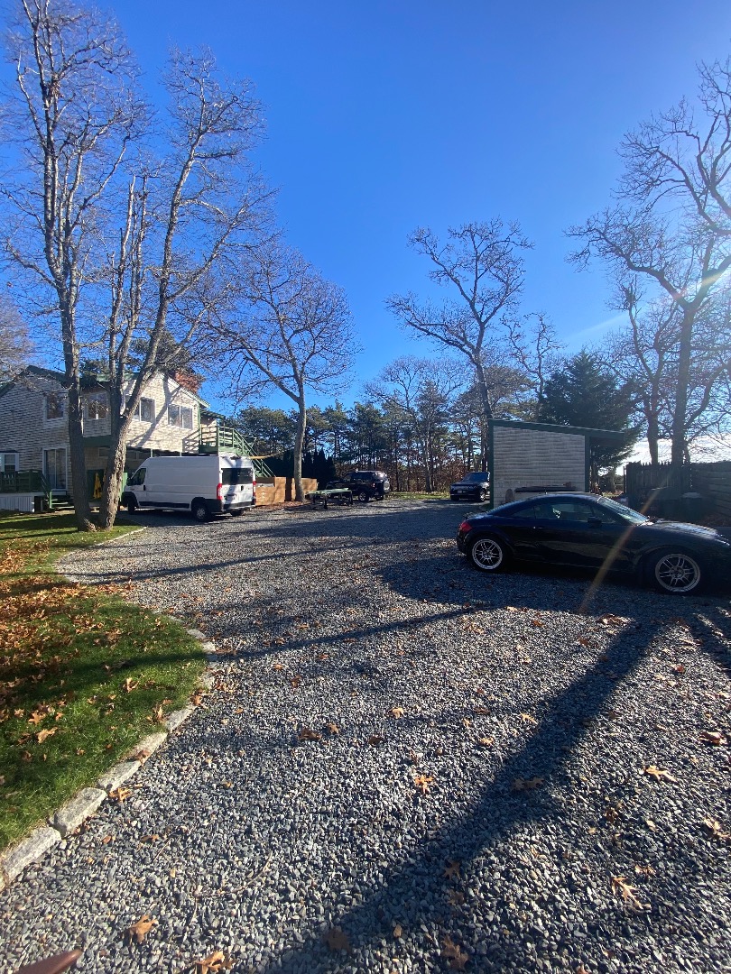 101 Tradewinds Road Oak Bluffs, MA 02557 - Photo 44 of 59 a cars parked on the side of the road