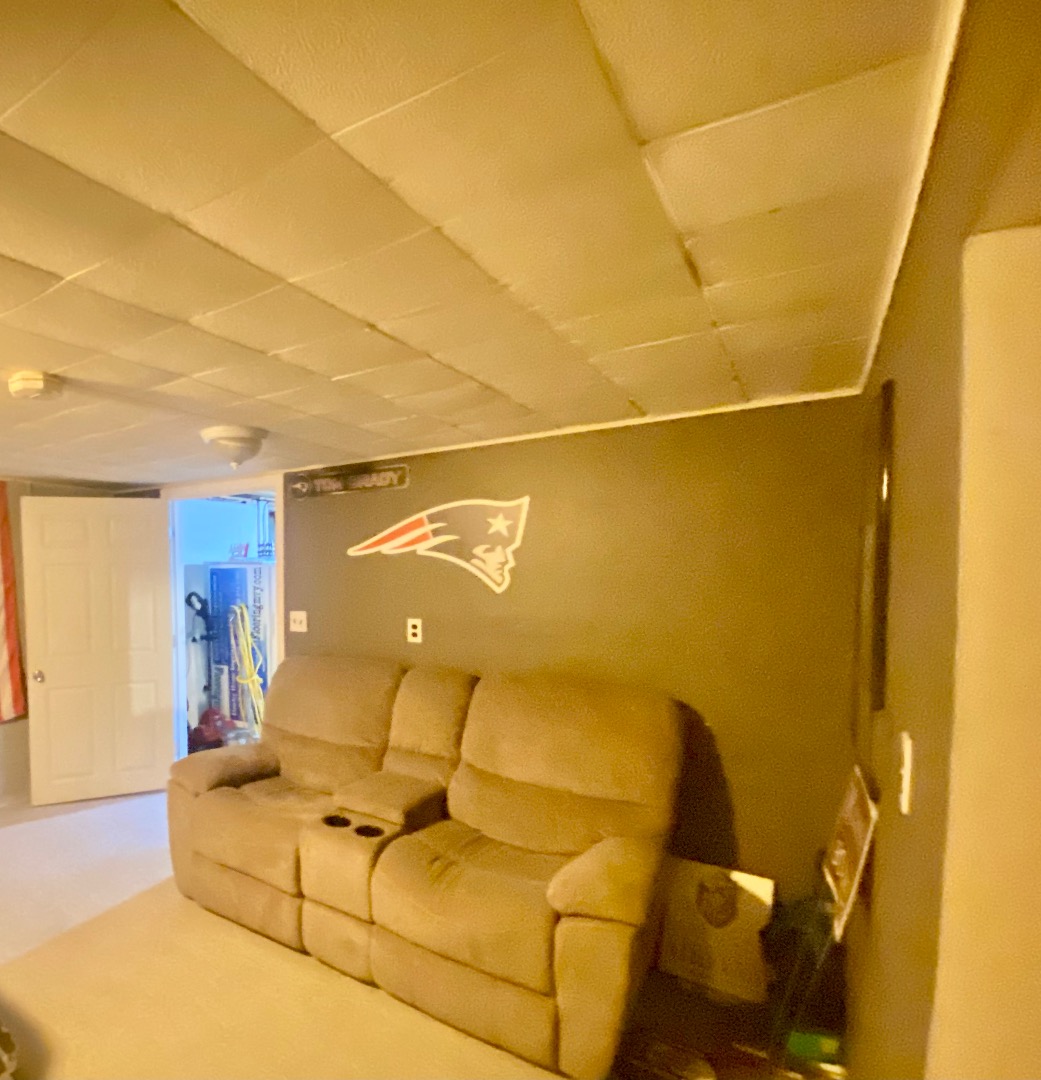 101 Tradewinds Road Oak Bluffs, MA 02557 - Photo 46 of 59 a projector room with a couch