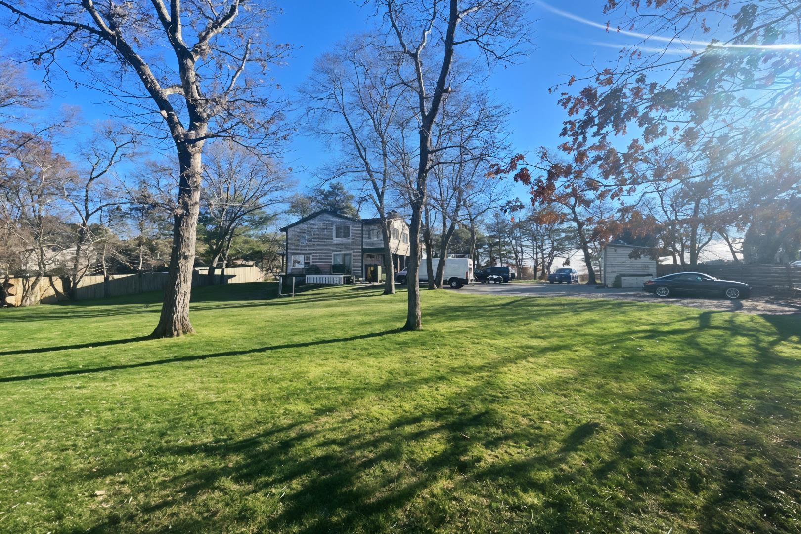 101 Tradewinds Road Oak Bluffs, MA 02557 - Photo 53 of 59 a view of field with tall trees