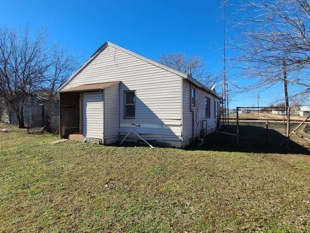 a view of a backyard of the house