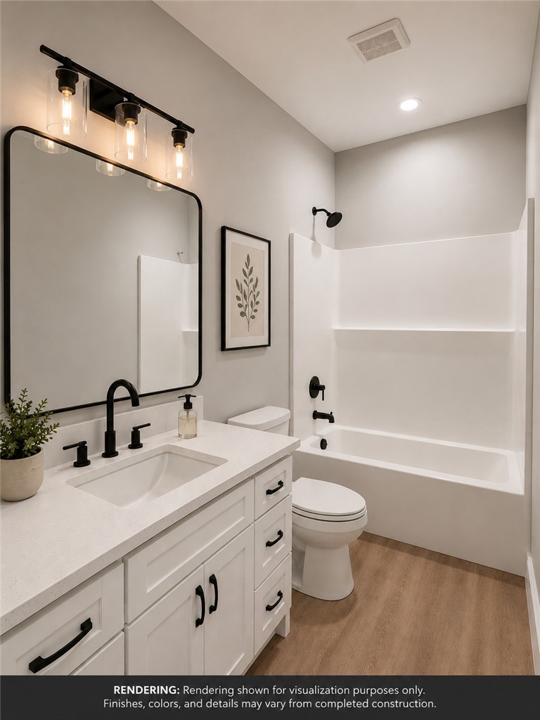 513 Quail Hollow Road Anderson, SC 29621 - Photo 27 of 39 This bright bathroom features a vanity with a sleek sink and a classic tub and shower combination.