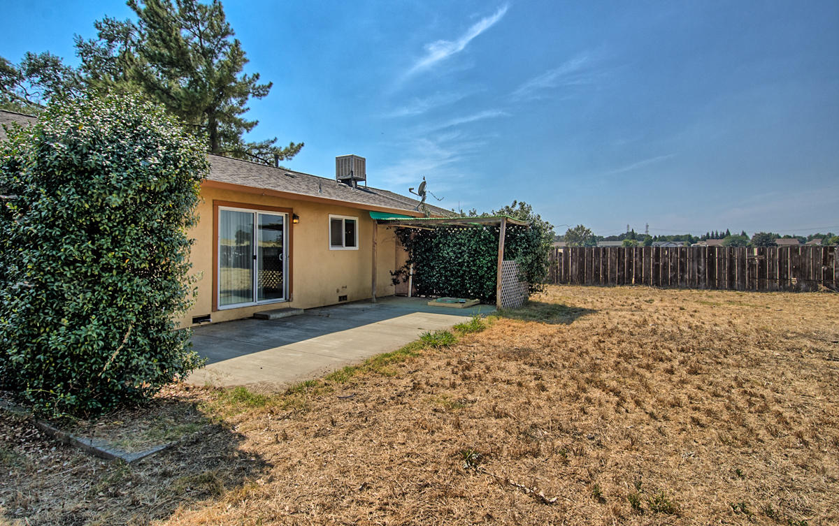 20458 Womack Road Red Bluff, CA 96080 - Photo 16 of 20 a view of a backyard with a tree