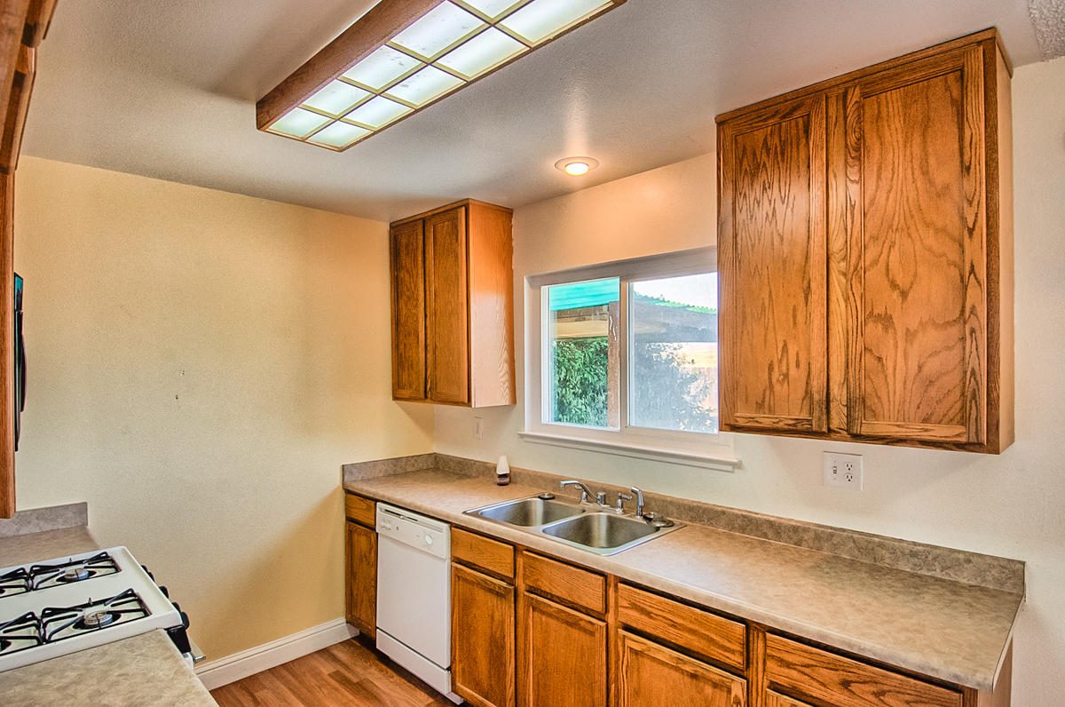 20458 Womack Road Red Bluff, CA 96080 - Photo 8 of 20 a view of a kitchen with a sink and windows
