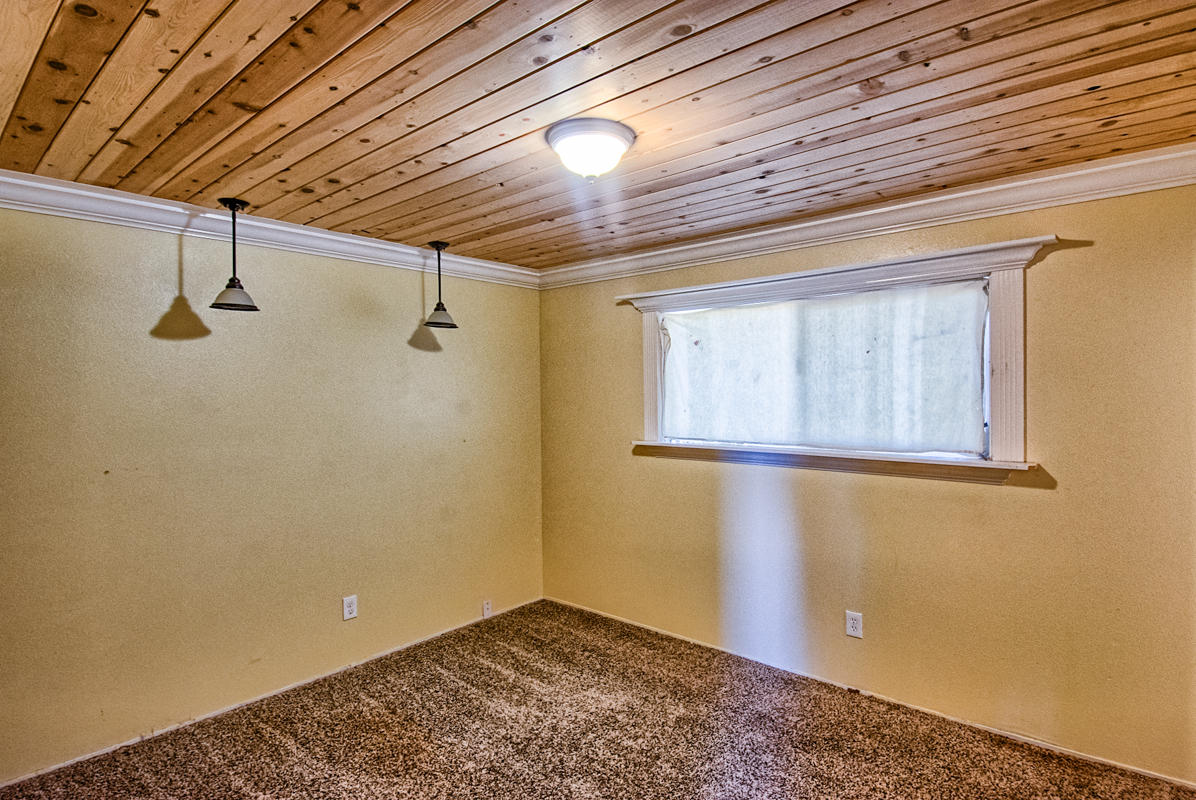 20458 Womack Road Red Bluff, CA 96080 - Photo 9 of 20 a view of empty room with windows