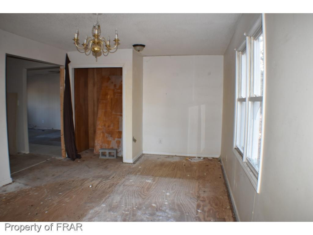 216 R Sands Road Carthage, NC 28327 - Photo 12 of 28 a view of an entryway with a chandelier