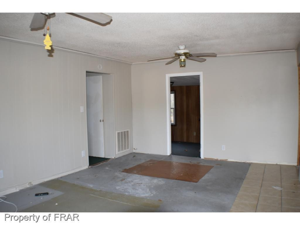 216 R Sands Road Carthage, NC 28327 - Photo 3 of 28 a view of a room with an empty space
