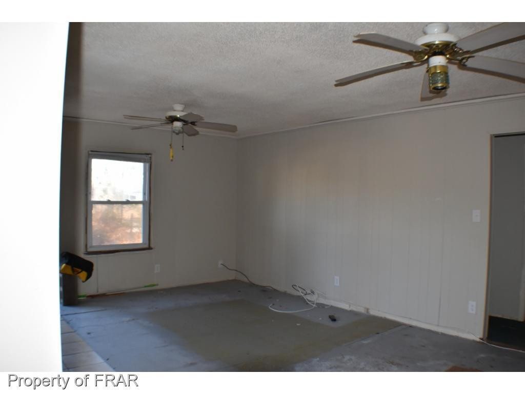 216 R Sands Road Carthage, NC 28327 - Photo 4 of 28 a view of an empty room and window
