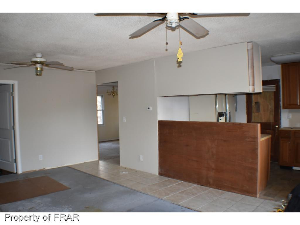 216 R Sands Road Carthage, NC 28327 - Photo 5 of 28 a view of a kitchen from a hallway