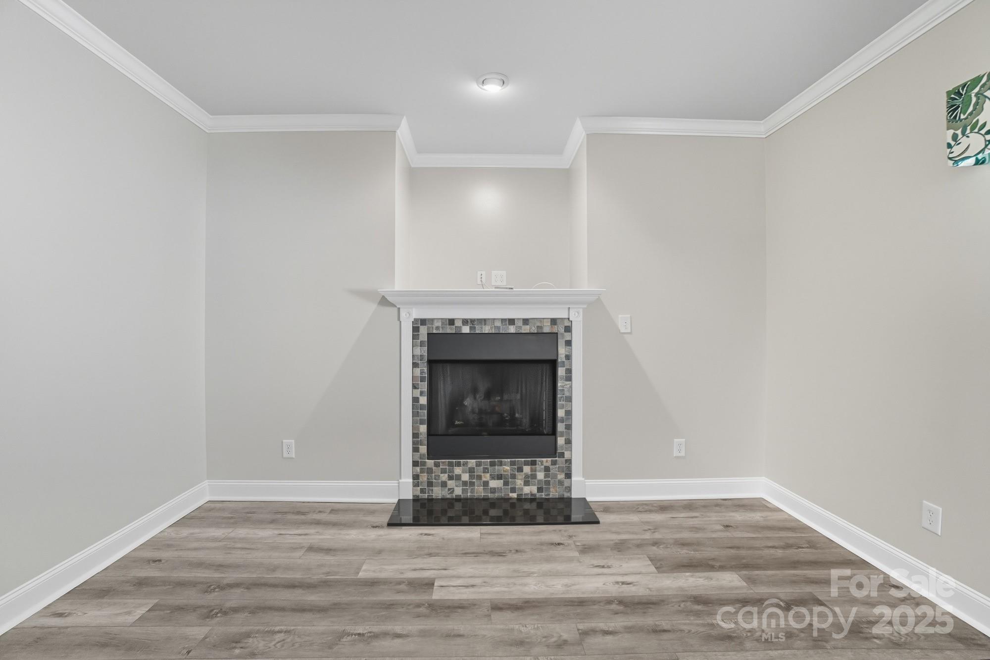 3633 Creek Ridge Drive Denver, NC 28037 - Photo 11 of 47 a view of an empty room with a fireplace and a window