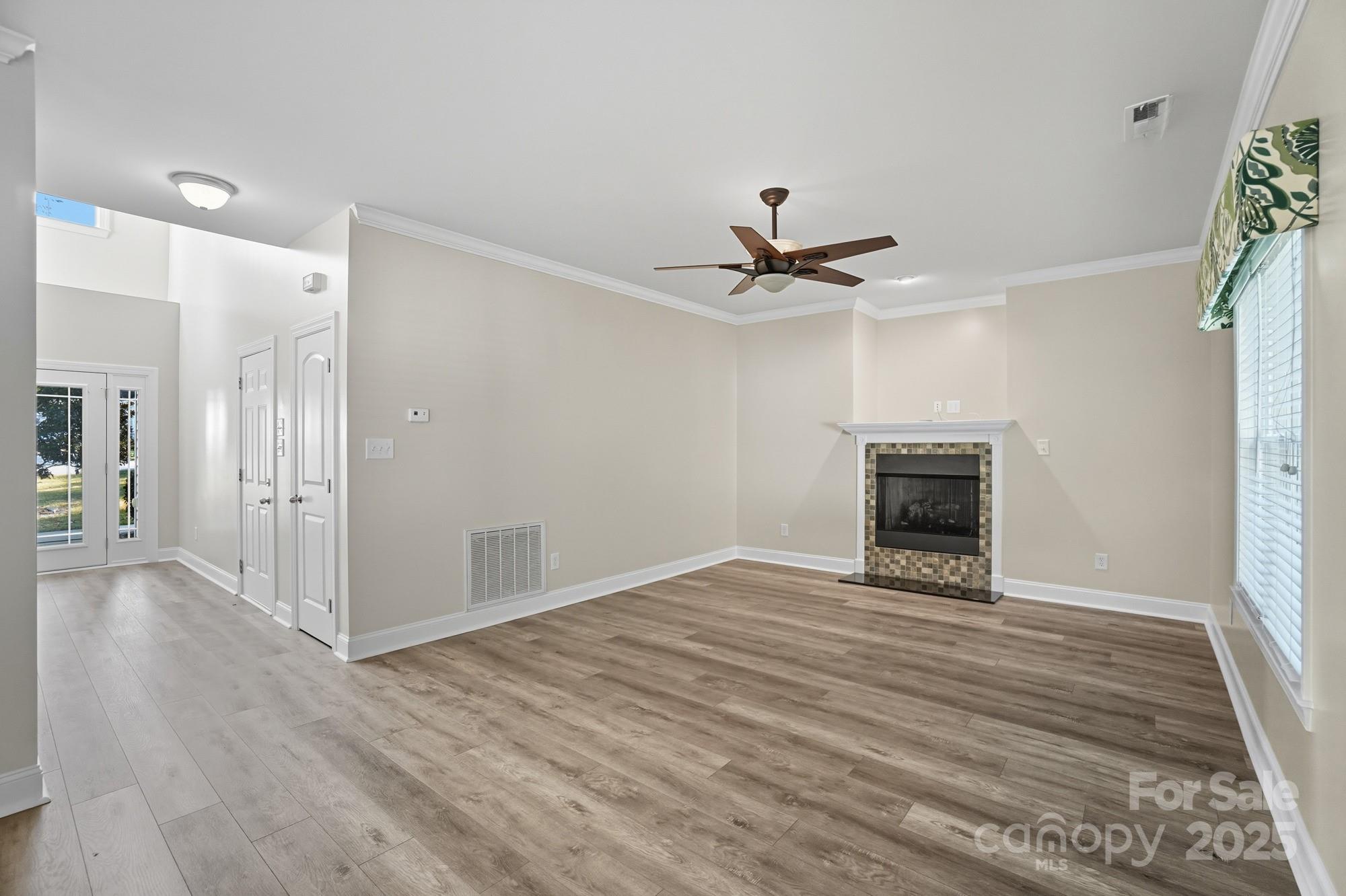3633 Creek Ridge Drive Denver, NC 28037 - Photo 12 of 47 a view of an empty room with wooden floor