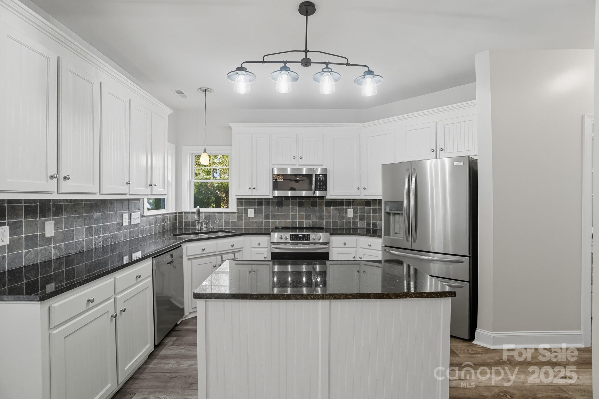 3633 Creek Ridge Drive Denver, NC 28037 - Photo 13 of 47 a kitchen with stainless steel appliances granite countertop a sink and refrigerator