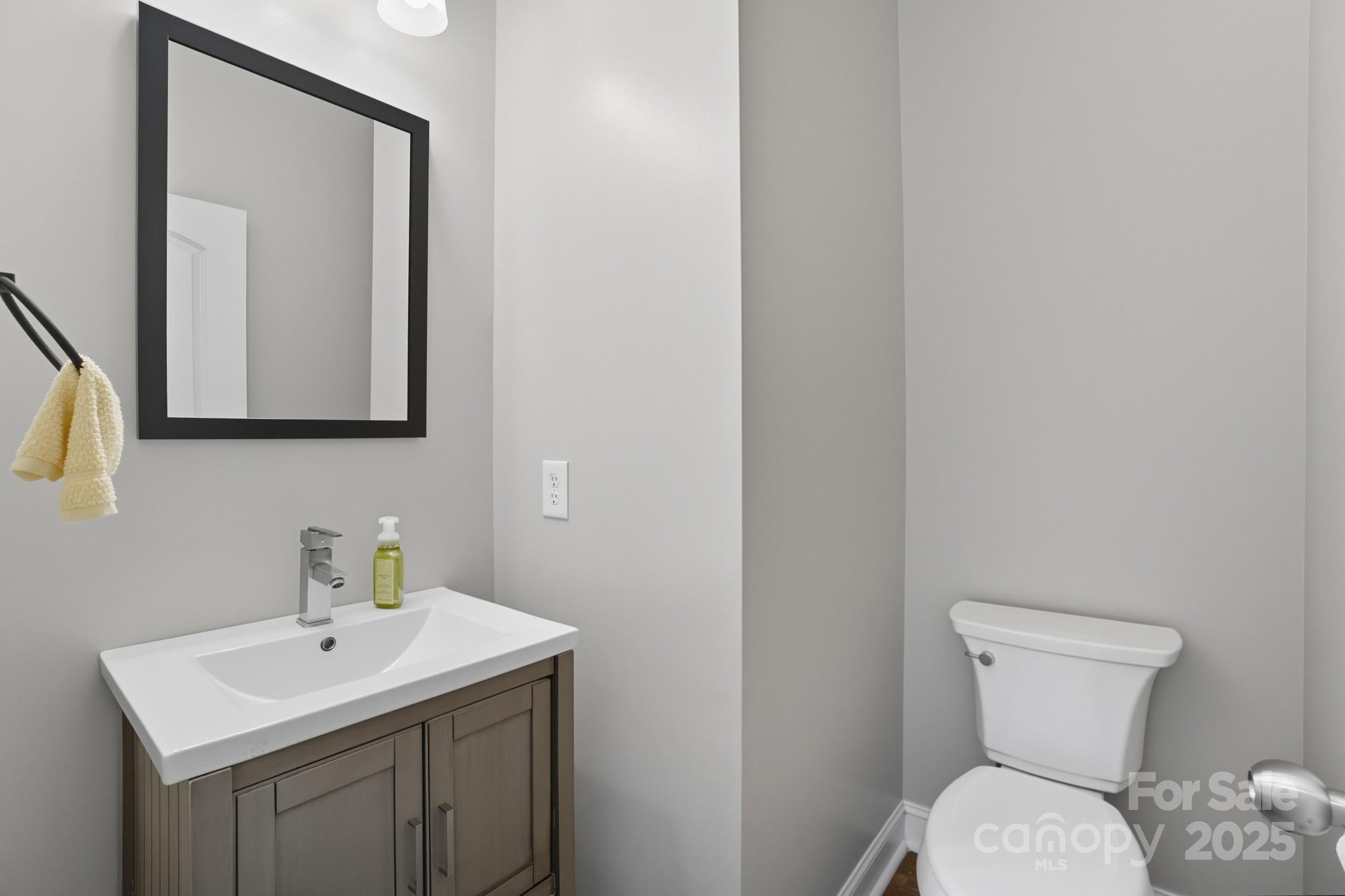 3633 Creek Ridge Drive Denver, NC 28037 - Photo 19 of 47 a bathroom with a toilet sink and mirror