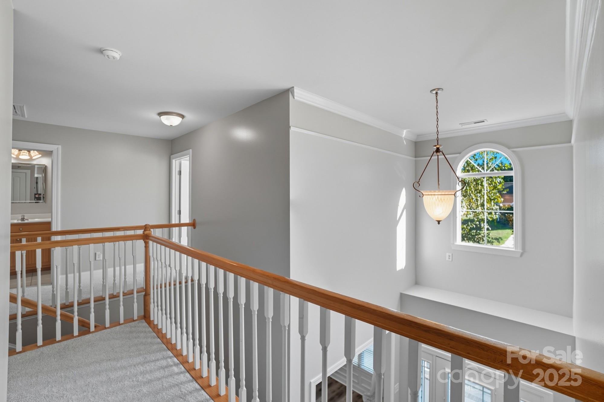 3633 Creek Ridge Drive Denver, NC 28037 - Photo 22 of 47 a view of a hallway with windows and chandelier