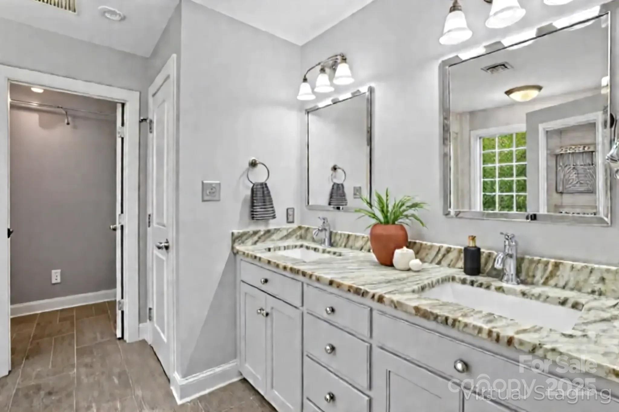 3633 Creek Ridge Drive Denver, NC 28037 - Photo 28 of 47 a bathroom with a granite countertop sink and a mirror