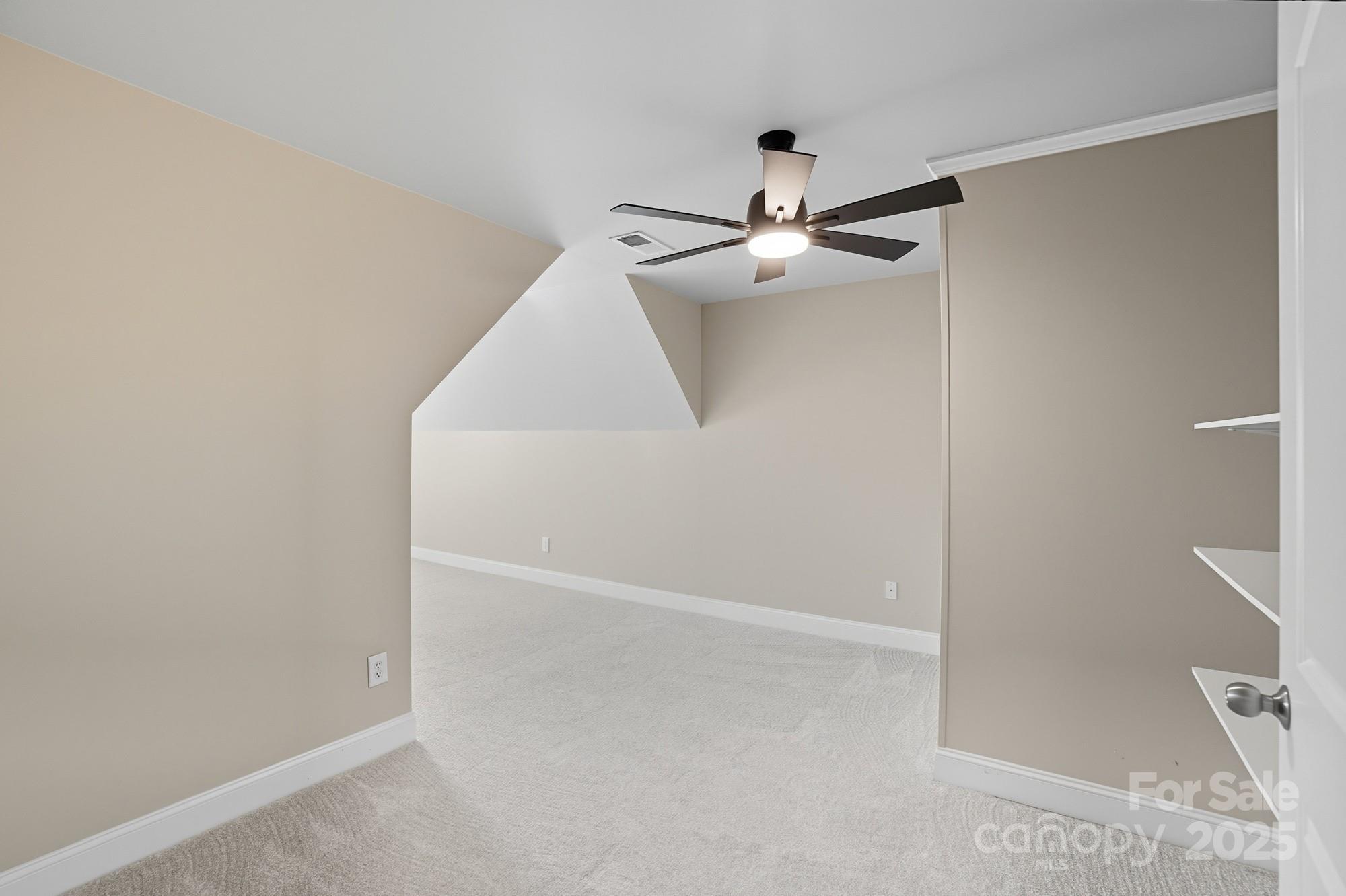 3633 Creek Ridge Drive Denver, NC 28037 - Photo 31 of 47 an empty room with ceiling fan and entryway
