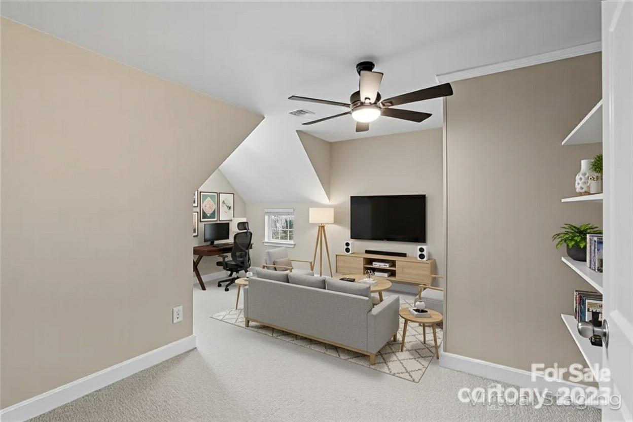 3633 Creek Ridge Drive Denver, NC 28037 - Photo 32 of 47 a living room with furniture and a flat screen tv