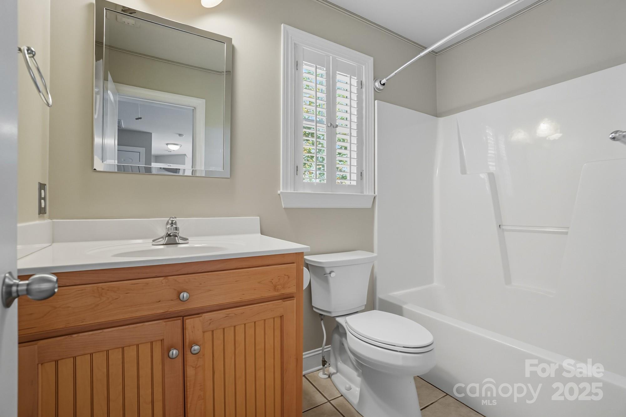 3633 Creek Ridge Drive Denver, NC 28037 - Photo 38 of 47 a bathroom with a sink a toilet and a mirror