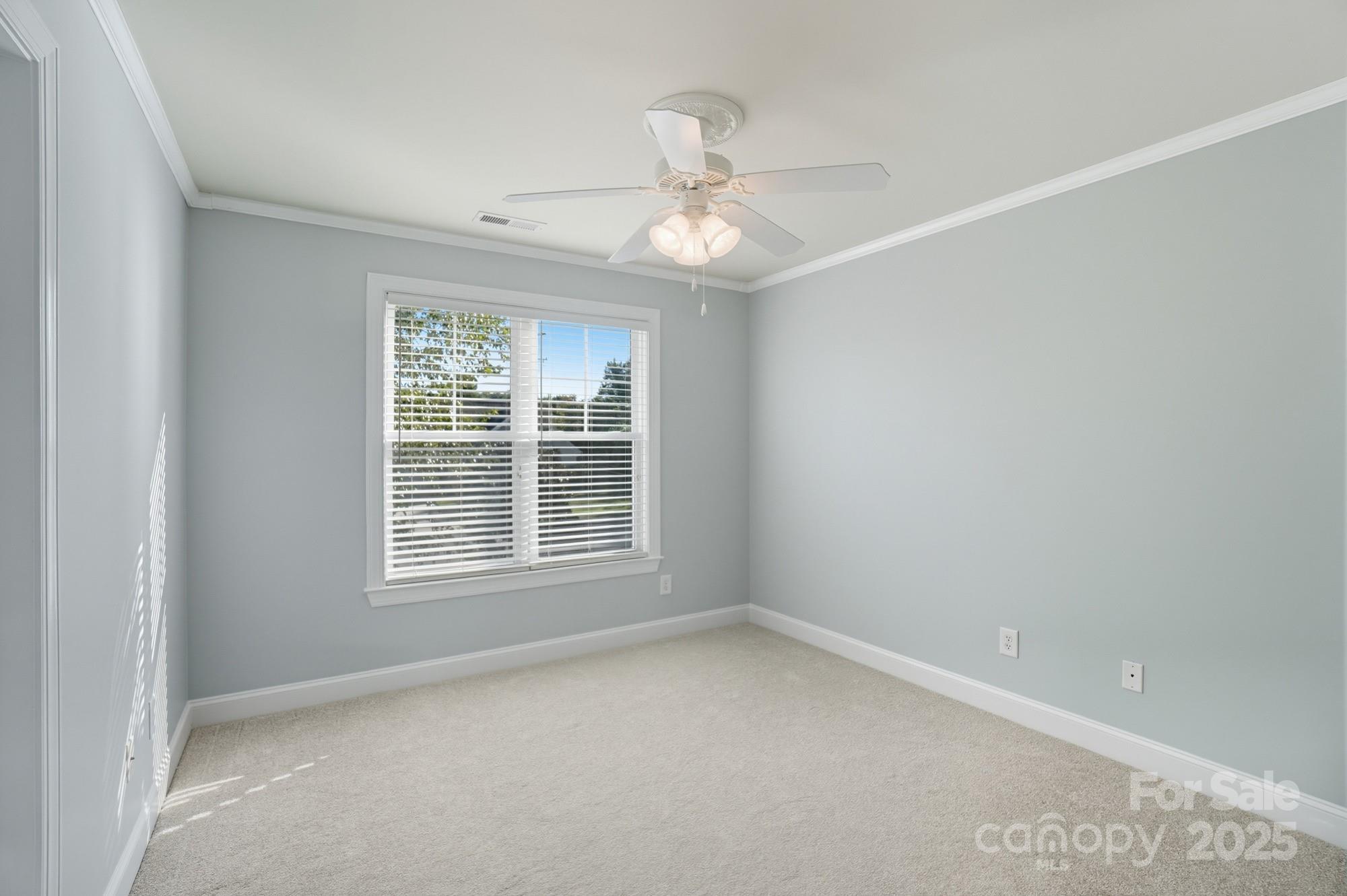 3633 Creek Ridge Drive Denver, NC 28037 - Photo 40 of 47 an empty room with a window and a fan