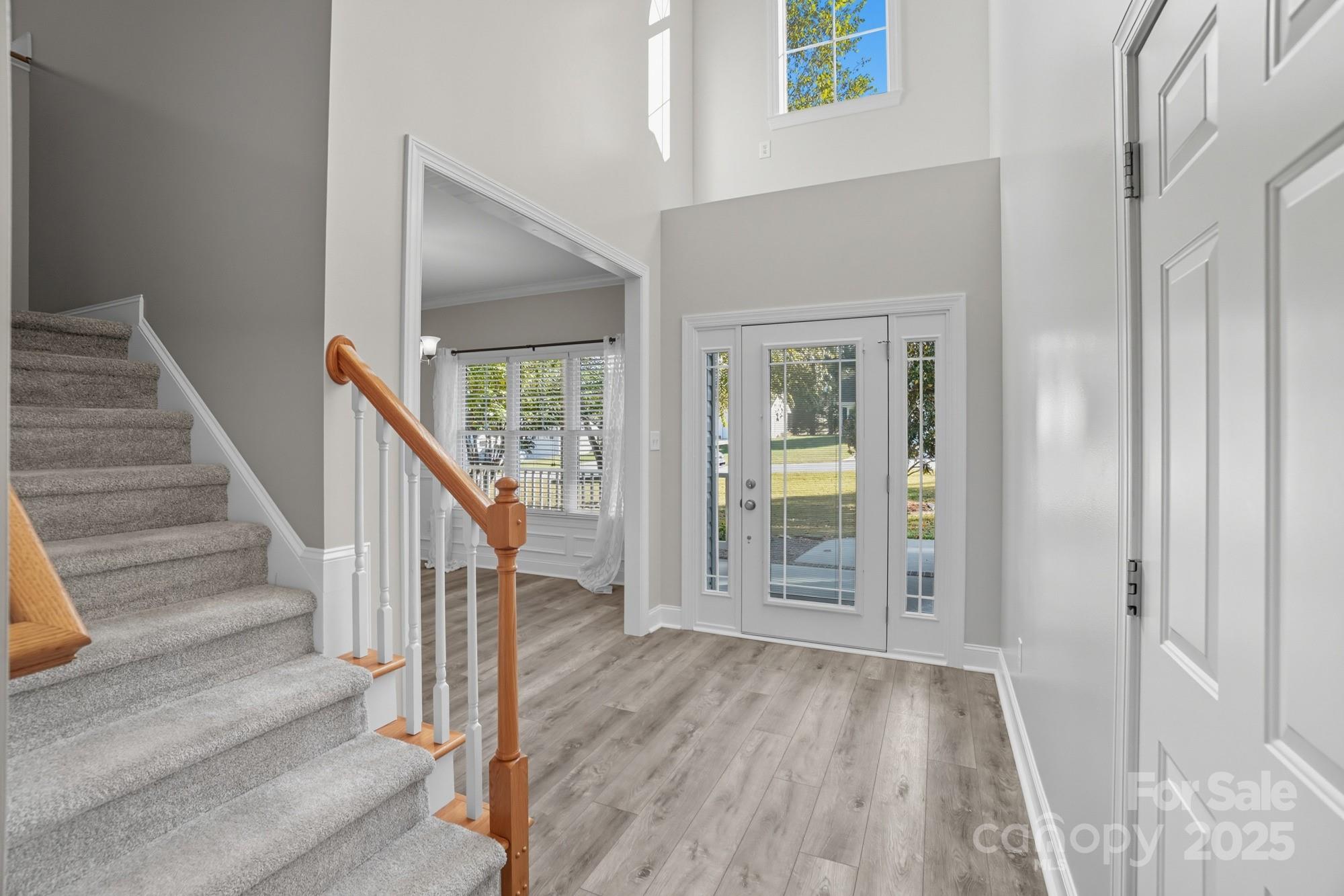 3633 Creek Ridge Drive Denver, NC 28037 - Photo 4 of 47 a view of entryway with wooden floor and stairs