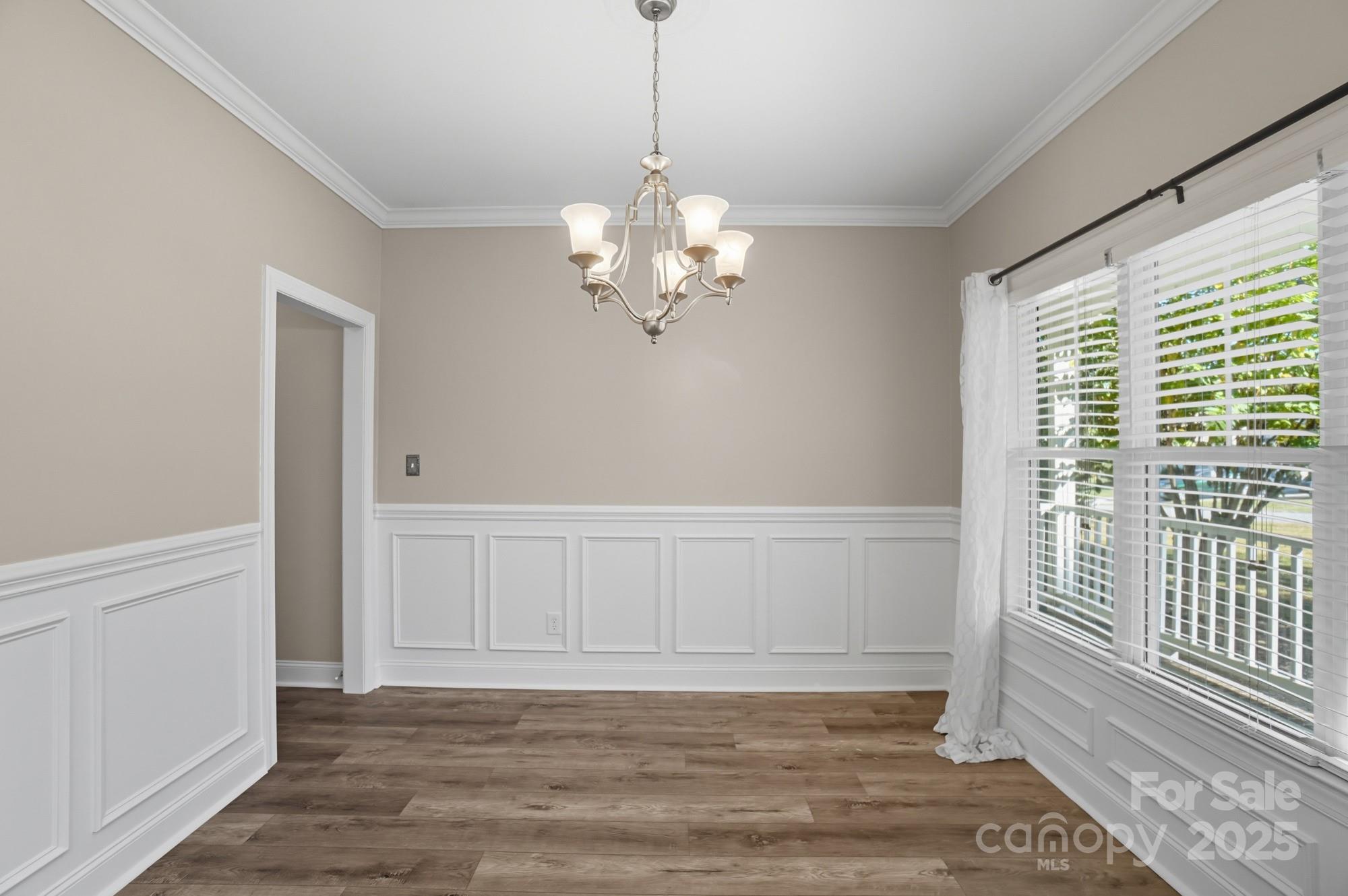 3633 Creek Ridge Drive Denver, NC 28037 - Photo 6 of 47 a view of an empty room with wooden floor and a window