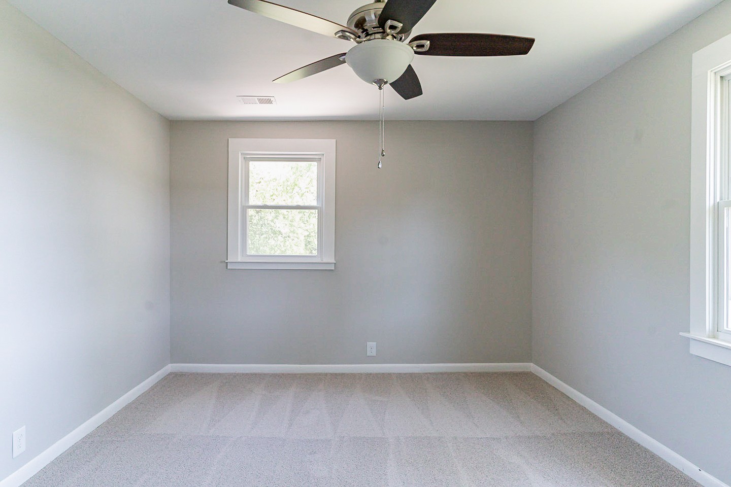 310 Tom Link Road Cottontown, TN 37048 - Photo 17 of 44 an empty room with a window and a fan
