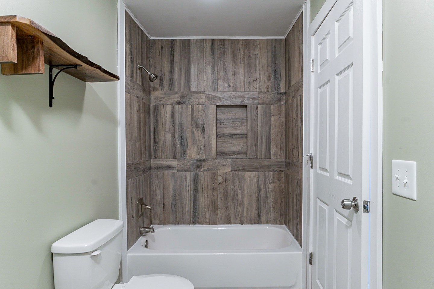 310 Tom Link Road Cottontown, TN 37048 - Photo 21 of 44 a bathroom with a bathtub a toilet and a shower