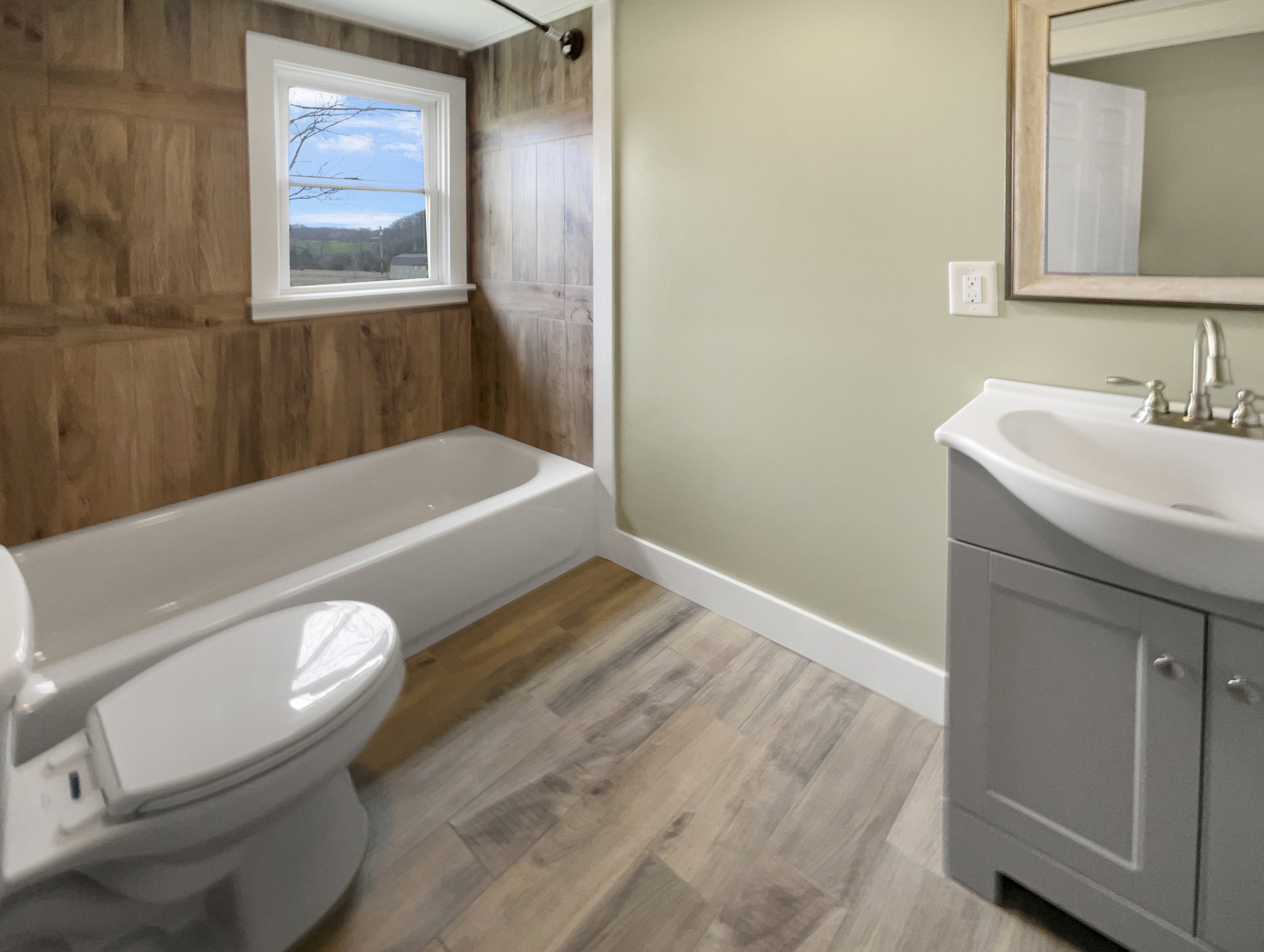 310 Tom Link Road Cottontown, TN 37048 - Photo 23 of 44 a bathroom with a sink and a bathtub