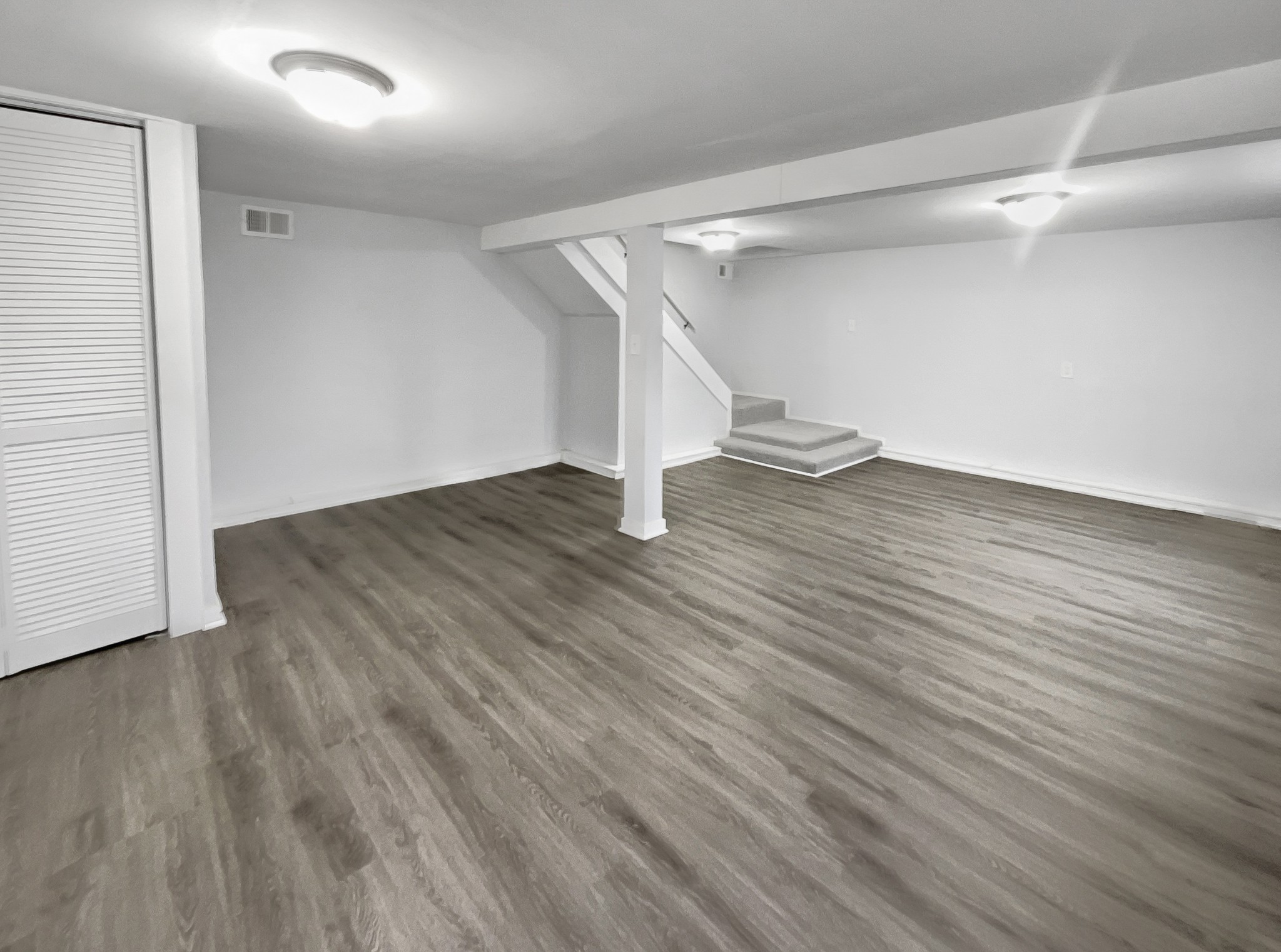 310 Tom Link Road Cottontown, TN 37048 - Photo 27 of 44 a view of an empty room with wooden floor