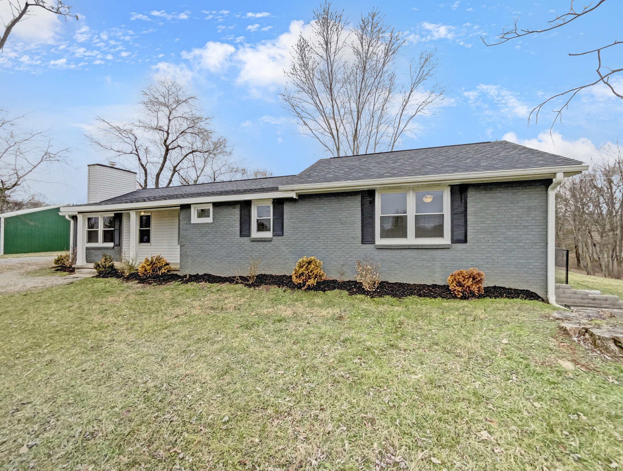 310 Tom Link Road Cottontown, TN 37048 - Photo 44 of 44 a backyard of a house with table and chairs