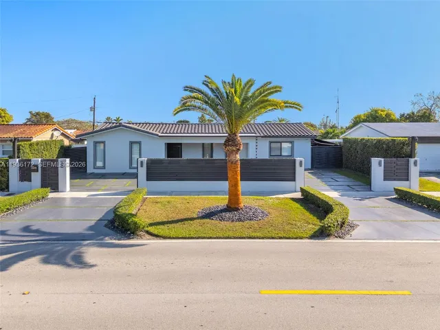 a house with swimming pool in front of it