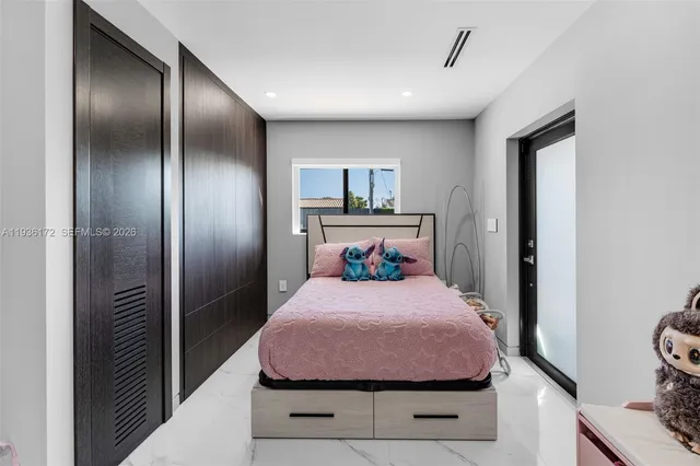 a living room with furniture and flowers