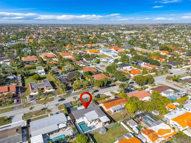 an aerial view of residential building with parking space