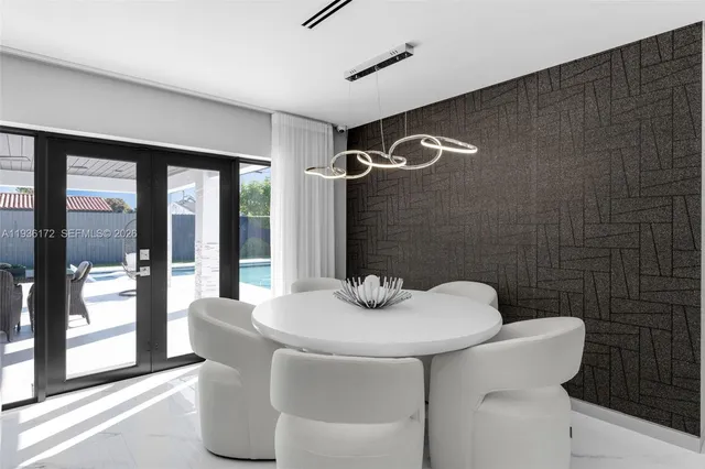 a kitchen with stainless steel appliances a sink and a refrigerator