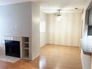 an empty room with closet and windows