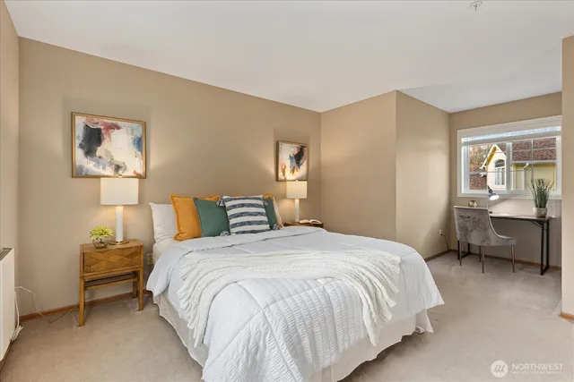 a bedroom with a bed and a couch