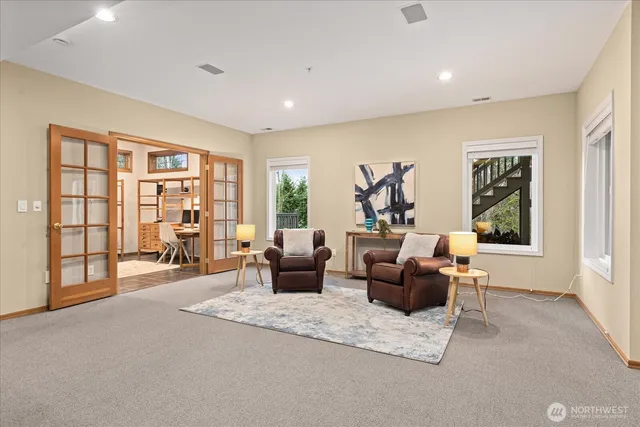a living room with furniture and a large window