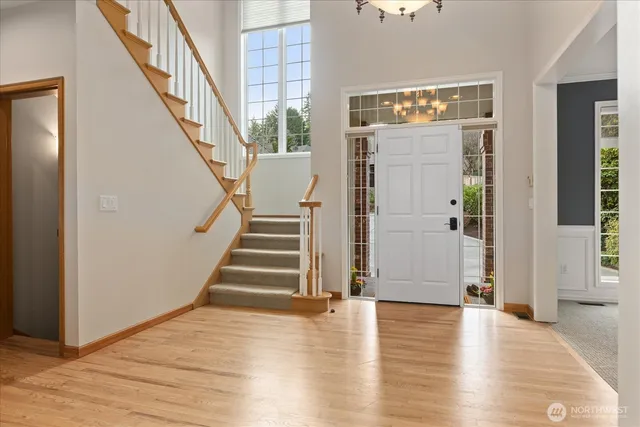 a view of an entryway with wooden floor