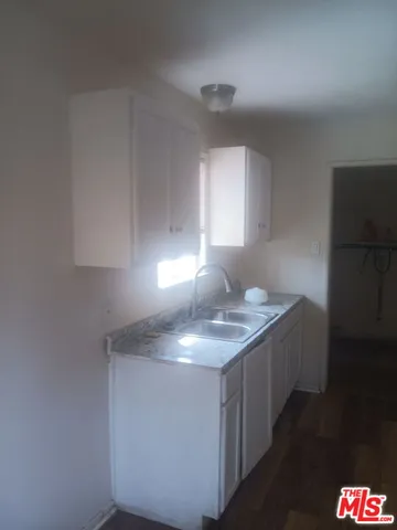 a bathroom with a sink toilet and a mirror