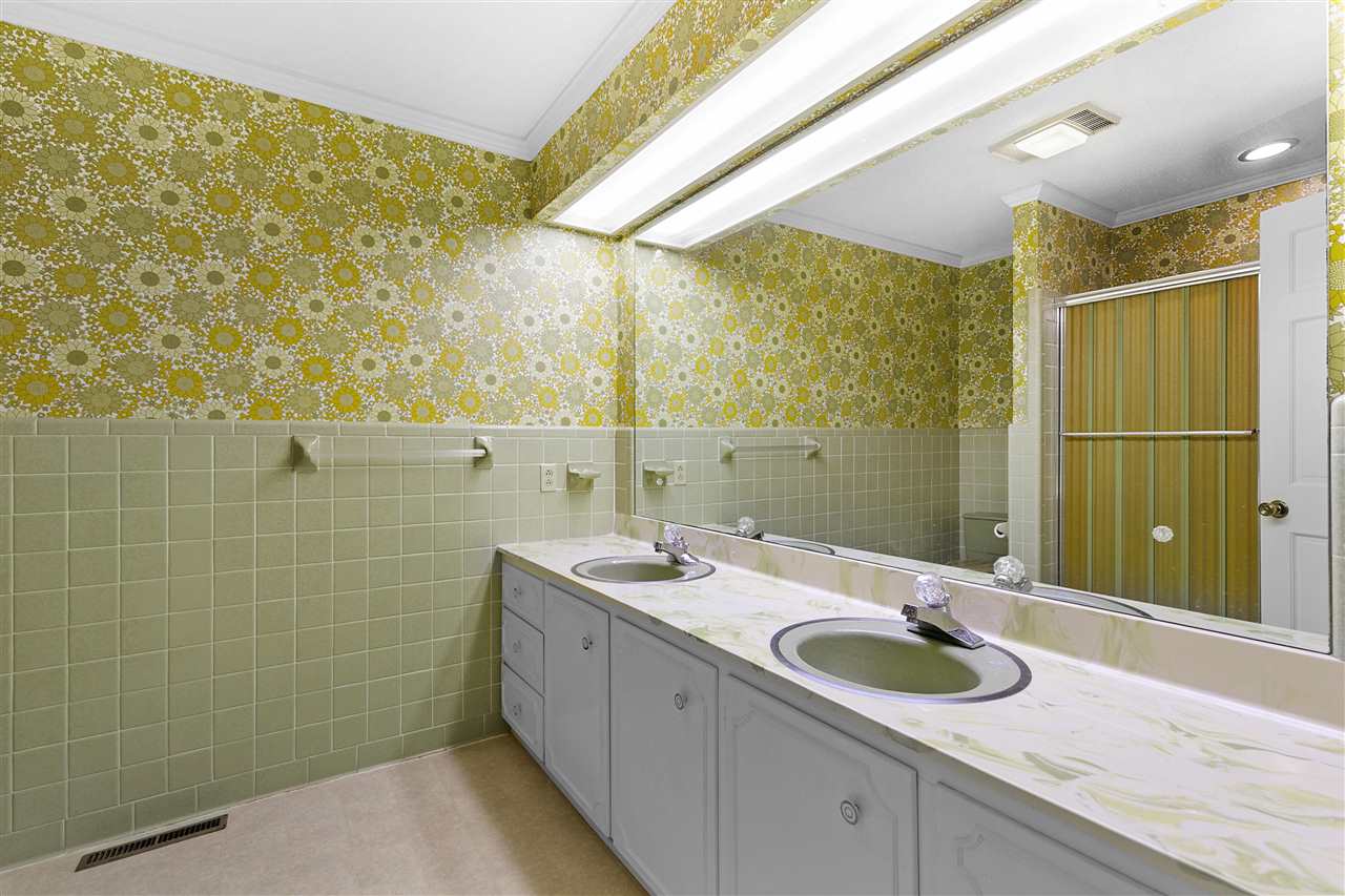 65 Reed Road Dyer, TN 38330 - Photo 21 of 25 Large bathroom with double sinks, built in laundry hamper. Lots of storage space
