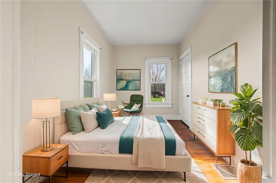 10797 Gratis Jacksonburg Road Somerville, OH 45064 - Photo 15 of 27 This serene bedroom offers ample natural light and beautiful hardwood floors, perfect for relaxation.