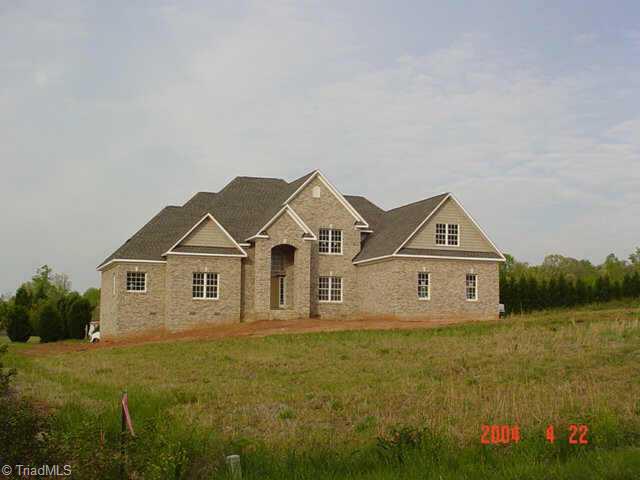 6011 Beckenham Way Oak Ridge, NC 27310 - Photo 1 of 8 Exterior Front.