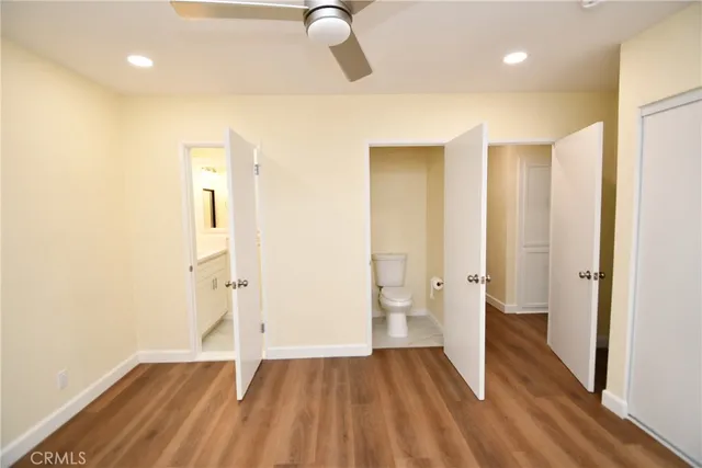 a view of a bathroom with wooden floor