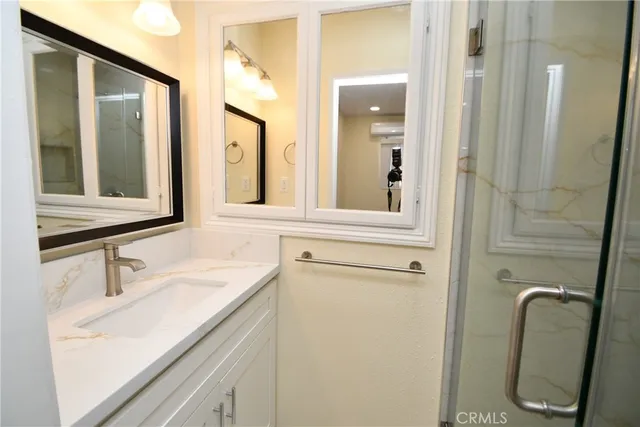 a bathroom with a sink and a mirror