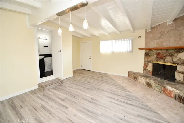 a view of a livingroom with wooden floor