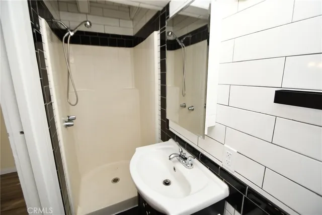 a bathroom with a sink and mirror