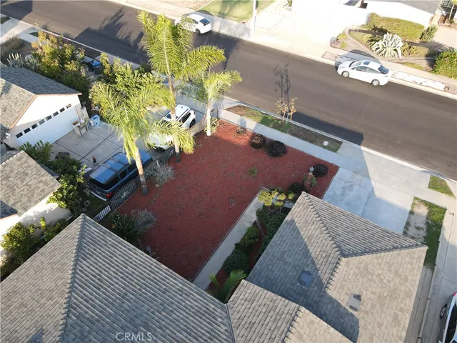 an aerial view of a house with yard swimming pool and outdoor seating